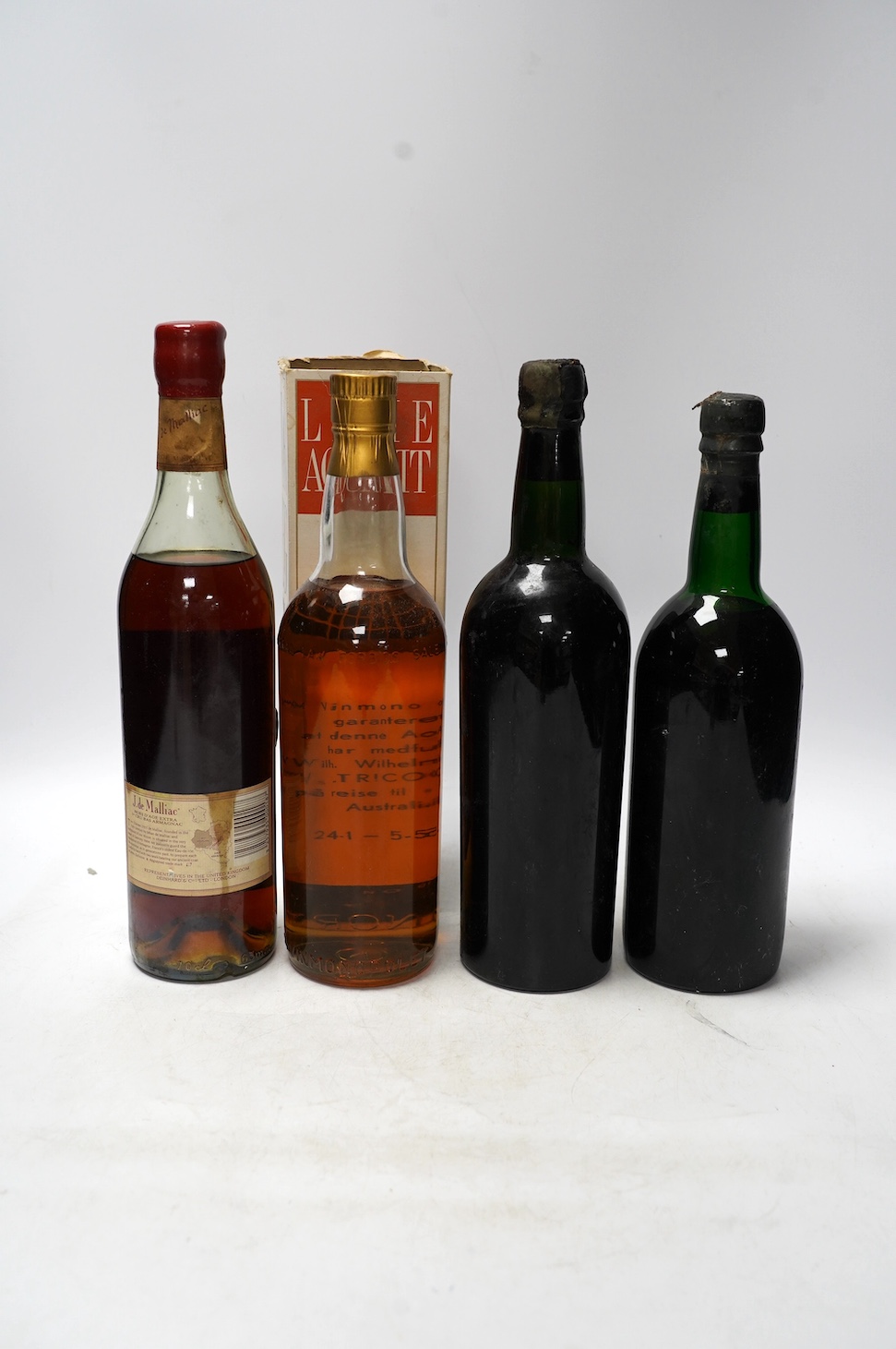 Four various bottles of alcohol to include a bottle of Taylor’s 1966 vintage port, another 1960 vintage port (label corroded), a bottle of J.de Malliac Bas Armagnac Extra Hors D’Age No.12440 and a bottle of Linie Aquavit
